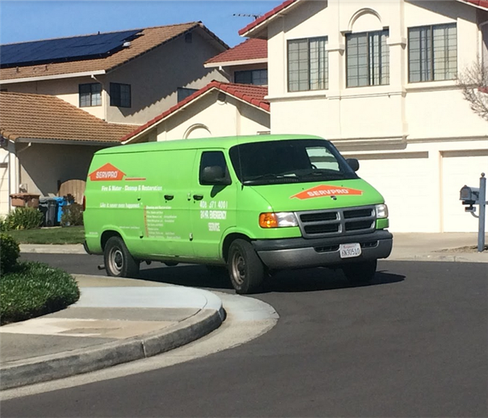 a SERVPRO van parked in the street