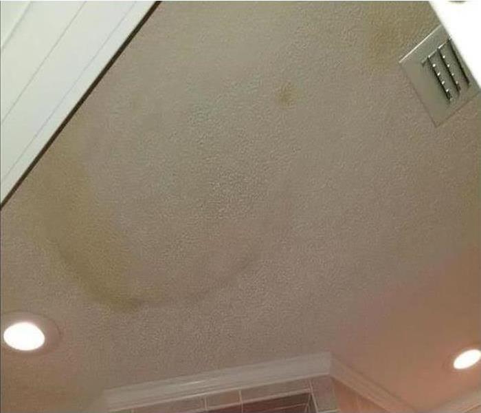 Stained ceiling due to water. Roof leak